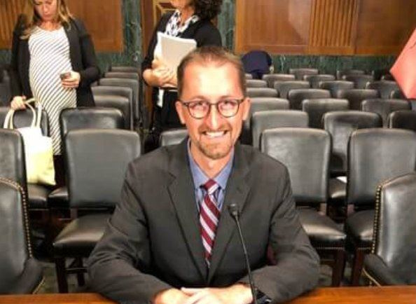 Chris McKenna at Congressional testimony, nameplate reading Mr. Christopher McKenna